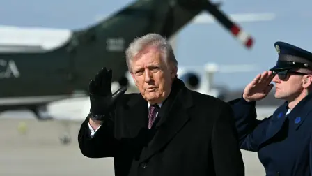 US President Donald Trump waves as he steps off Air Force One at Joint Base Andrews, Maryland, on his way back from Dover Air Force Base in Delaware after attending a dignified transfer solemn event on March 18, 2026. President Trump traveled to Dover Air Force Base to pay his respects to 6 US military members who were killed during a crash of a refueling aircraft in western Iraq last week. (Photo by Jim WATSON / AFP)