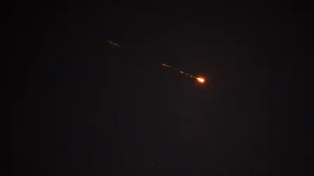 A rocket trail is seen in the sky above the Israeli coastal city of Netanya amid a fresh barrage of Iranian missiles on March 30, 2026. The Middle East was sparked by joint US-Israeli strikes on Iran that triggered a wave of retaliatory missile and drone attacks against Israel and several other countries in the region. (Photo by JACK GUEZ / AFP) /