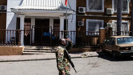 A soldier patrols in front of the Provisional Electoral Council (CEP) as the government announces the registration period for political parties ahead of the upcoming general election, in Port-au-Prince, Haiti, on March 3, 2026. Haiti's presidential transitional council, which has run the impoverished Caribbean nation for nearly two years, on February 7, 2026, handed power to US-backed Prime Minister Alix Didier Fils-Aime, after failing to rein in rampant gang violence. Rubio said in February he was upbeat about progress in setting up a new UN-blessed force to suppress Haiti's powerful gangs and voiced hope that the country will finally hold elections this year for the first time in a decade. (Photo by Clarens SIFFROY / AFP)