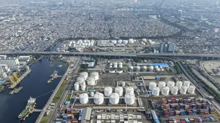 This aerial picture shows the oil depot and container terminal of Tanjung Priok Port, Jakarta, on March 31, 2026. (Photo by BAY ISMOYO / AFP)