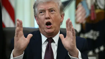 US President Donald Trump speaks after signing an executive order in the Oval Office of the White House in Washington, DC, on March 31, 2026. (Photo by Brendan SMIALOWSKI / AFP)