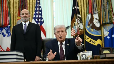 US President Donald Trump (R) speaks as Commerce Secretary Howard Lutnick (L) looks on after signing an executive order in the Oval Office of the White House in Washington, DC, on March 31, 2026. (Photo by Brendan SMIALOWSKI / AFP)