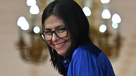 (FILES) Venezuela's interim President Delcy Rodriguez smiles during a press conference at the Miraflores Presidential Palace in Caracas on January 14, 2026. The United States lifted sanctions on Venezuelan interim President Delcy Rodriguez on April 1, 2026, who took power after Washington ousted her predecessor Nicolas Maduro in a military operation. Rodriguez's name was deleted from the US "Specially Designated Nationals List" according to a post on the US Treasury's Office of Foreign Assets Control website. (Photo by Juan BARRETO / AFP)