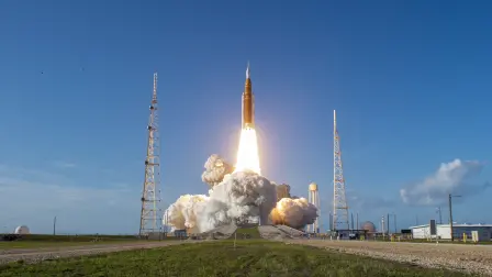 The Artemis II crewed lunar mission lifts off from Pad 39B at Kennedy Space Center in Cape Canaveral, Florida, on April 1, 2026. Four astronauts blasted off aboard a massive NASA rocket April 1 on a long-anticipated journey around the Moon, the first crewed lunar flyby in more than 50 years. With an intense roar that reverberated far beyond the launchpad, the enormous orange-and-white rocket carried three Americans and one Canadian away from Florida's Kennedy Space Center at approximately 6:35 pm local time, according to an AFP journalist onsite. "We're going to the Moon!" yelled a spectator. (Photo by Jim Watson / AFP)