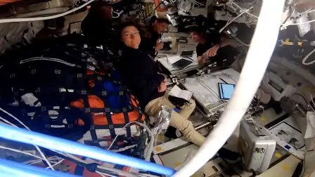 This screengrab taken from a NASA livestream shows Artemis II crew NASA's pilot Victor Glover, NASA's commander Reid Wiseman, Canadian Space Agency's mission specialist Jeremy Hansen and NASA's mission specialist Christina Koch aboard Orion Integrity spacecraft on April 6, 2026. The four astronauts embarking on NASA's lunar flyby became on April 6 the humans to travel furthest from our planet, as they get set to view areas of the Moon never before seen by the naked eye. The Artemis II team broke the previous record set by 1970's Apollo 13 mission, which they are expected to surpass by approximately 4,105 miles (6,606 kilometers) when they reach this journey's anticipated furthest distance from Earth -- 252,760 miles (406,778 kilometers) -- later today. (Photo by Handout / NASA / AFP) / RESTRICTED TO EDITORIAL USE - MANDATORY CREDIT "AFP PHOTO / NASA" - HANDOUT - NO MARKETING NO ADVERTISING CAMPAIGNS - DISTRIBUTED AS A SERVICE TO CLIENTS