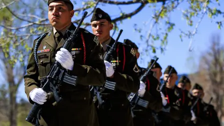COLORADO SPRINGS, COLORADO - APRIL 2: The Fort Carson Honor Detail firing team marches past a memorial ceremony for Army Staff Sgt. Benjamin N. Pennington at the Fort Carson Soldiers Memorial Chapel on April 2, 2026 in Colorado Springs, Colorado. Pennington passed away on March 8 after succumbing to injuries sustained in an Iranian attack on Prince Sultan Air Base in Saudi Arabia during Operation Epic Fury.   Michael Ciaglo/Getty Images/AFP (Photo by Michael Ciaglo / GETTY IMAGES NORTH AMERICA / Getty Images via AFP)