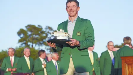 AUGUSTA, GEORGIA - APRIL 12: Rory McIlroy of Northern Ireland poses with the Masters Trophy during the Green Jacket Ceremony after winning the final round of the 2026 Masters Tournament at Augusta National Golf Club on April 12, 2026 in Augusta, Georgia.   Hector Vivas/Getty Images/AFP (Photo by Hector Vivas / GETTY IMAGES NORTH AMERICA / Getty Images via AFP)