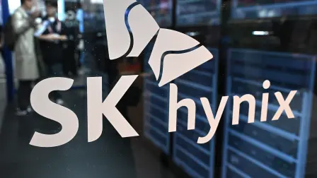The logo of SK hynix is displayed on a glass wall during the 2026 World IT Show in Seoul on April 22, 2026. (Photo by Jung Yeon-je / AFP)