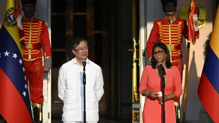 Venezuela's interim president Delcy Rodriguez (R) and Colombian President Gustavo Petro deliver statements after a bilateral meeting at the Miraflores presidential palace in Caracas on April 24, 2026. Colombia's President Gustavo Petro arrived in Venezuela on April 24 for a bilateral meeting with interim President Delcy Rodriguez, focusing on border security and energy cooperation. (Photo by Federico PARRA / AFP)