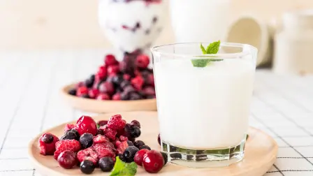 yogurt with mixed berries on the table