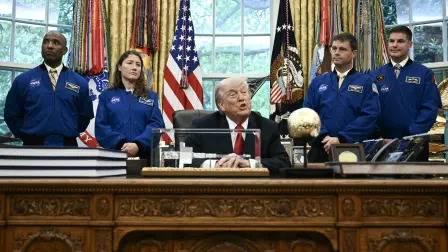 US President Donald Trump speaks as he welcomes the Artemis II astronauts, from L to R, Victor Glover, Christina Koch, Reid Wiseman and Jeremy Hansen in the Oval Office at the White House in Washington, DC, on April 29, 2026. (Photo by Brendan SMIALOWSKI / AFP)