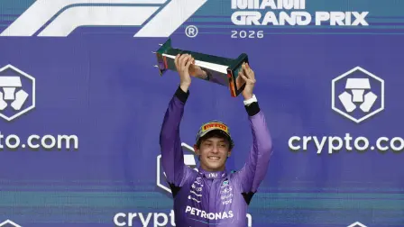 Formula One F1 - Miami Grand Prix - Miami International Autodrome, Miami, Florida, United States - May 3, 2026 Mercedes' Andrea Kimi Antonelli celebrates on the podium with a trophy after winning the Miami Grand Prix REUTERS/Marco Bello