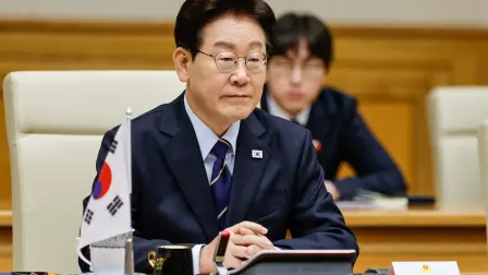 South Korea's President Lee Jae Myung sits during a meeting with Vietnam's Prime Minister Le Minh Hung at the Government Office in Hanoi on April 23, 2026. (Photo by LUONG THAI LINH / POOL / AFP)