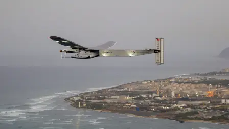 (FILES) The Solar Impulse 2 solar powered airplane flies off Kapolei, Hawaii, on March 3, 2016 on a all-day test flight. Bertrand Piccards pioneering aircraft, which completed a round-the-world flight in 2016 using electric batteries, crashed into the sea in the Gulf of Mexico after being converted into a drone, according to its owner in the United States. In July 2016, Solar Impulse 2 completed a historic round-the-world flight in Abu Dhabi, flying day and night on solar power and without a drop of fuel after a journey of 23 actual flight days and 43,041 km. (Photo by Eugene TANNER / AFP)