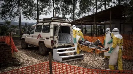(FILES) Health workers move a patient to a hospital after he was cleared of having Ebola inside a MSF (Doctors Without Borders) supported Ebola Treatment Centre (ETC) on November 4, 2018 in Butembo, Democratic Republic of the Congo. An outbreak of the ebola virus has been blamed for dozens of deaths in the east of the Democratic Republic of the Congo, African health authorities said on May 15, 2026.The outbreak is in Ituri province. (Photo by John WESSELS / AFP)