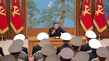 This picture taken on May 17, 2026 and released by North Korea's official Korean Central News Agency (KCNA) on May 18, 2026 shows North Korean leader Kim Jong Un (top C) speaking on key military issues during a meeting of commanding officers of the divisions and brigades of the entire army at the Party Central Committee headquarters in Pyongyang. (Photo by KCNA VIA KNS / AFP) / South Korea OUT / ---EDITORS NOTE--- RESTRICTED TO EDITORIAL USE - MANDATORY CREDIT "AFP PHOTO/KCNA VIA KNS" - NO MARKETING NO ADVERTISING CAMPAIGNS - DISTRIBUTED AS A SERVICE TO CLIENTSTHIS PICTURE WAS MADE AVAILABLE BY A THIRD PARTY. AFP CAN NOT INDEPENDENTLY VERIFY THE AUTHENTICITY, LOCATION, DATE AND CONTENT OF THIS IMAGE. /