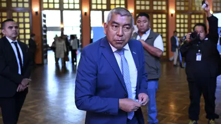 (FILES) The Head of the Guatemalan Special Prosecutors Office Against Impunity (FECI), Rafael Curruchiche, votes during an election to choose magistrates for the Constitutional Court at the Association of Attorneys and Notaries in Guatemala City on February 12, 2026. Guatemalas Attorney General, Gabriel Garcia Luna, dismissed on May 20, 2026, Rafael Curruchiche, head of the special unit that led a crackdown on journalists, former prosecutors, and former anti-corruption judges during the tenure of his predecessor, Consuelo Porras, who has been sanctioned by more than 40 countries. (Photo by JOHAN ORDONEZ / AFP)