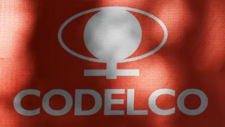 (FILES) The logo of the National Copper Corporation (CODELCO) is pictured on a sign with information about the remodeling of the facade of its building in Santiago on May 20, 2025. The Chilean state-owned company Codelco, the worlds largest copper producer, has launched an audit to investigate whether its copper production forecast for 2025 may have been overestimated, the company told AFP on May 13, 2026. (Photo by RODRIGO ARANGUA / AFP)