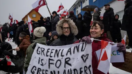 FILE PHOTO: People attend a protest against U.S. President Donald Trump's demand that the Arctic island be ceded to the U.S., calling for it to be allowed to determine its own future, in front of the U.S. consulate in Nuuk, Greenland, January 17, 2026. REUTERS/Marko Djurica/File Photo