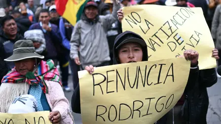 A demonstrator holds a sign reading (Resing Rodrigo) during a rally against President Rodrigo Paz in La Paz on May 25, 2026. Paz's presidency has been rocked by entrenched protests centered in Bolivia's administrative capital, La Paz, which have seen protestors block roads, leading to food, fuel and medicine shortages. (Photo by MARVIN RECINOS / AFP)