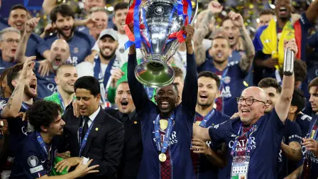 Soccer Football - UEFA Champions League - Final - Paris St Germain v Arsenal - Puskas Arena, Budapest, Hungary - May 30, 2026 Paris St Germain's Ousmane Dembele with the trophy as he celebrates with players and staff after winning the UEFA Champions League REUTERS/Phil Noble     TPX IMAGES OF THE DAY