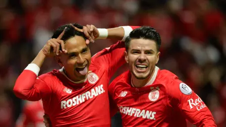 Toluca's midfielder #29 Jorge Diaz (L) celebrates with teammate midfielder #10 Jesus Angulo scoring the opening goal during the CONCACAF Champions Cup final football match between Mexicos Toluca and Tigres UANL at the Nemesio Diez Stadium in Toluca, Mexico on May 30, 2026. (Photo by Mario Vazquez / AFP)
