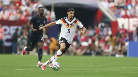 Germany's Aleksandar Pavlovic runs with the ball during the international friendly football match between USA and Germany at Soldier Field in Chicago, Illinois, on June 6, 2026. (Photo by KAMIL KRZACZYNSKI / AFP)