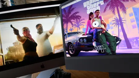 (FILES) This illustration photo created in Los Angeles, California, on December 5, 2023, shows Rockstar Games Grand Theft Auto 6 trailer played on computer screens. Thirteen years of waiting are about to come to an end: the video game "Grand Theft Auto VI," the latest installment in the saga from US studio Rockstar Games, opens for pre-orders on June 25, 2026, and is poised to become the biggest launch of a cultural product in history. (Photo by Chris DELMAS / AFP)
