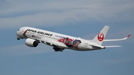 A Japan Airlines Airbus A350-900, painted with the face of Japanese baseball star Shohei Ohtani, takes off from Haneda airport in Tokyo on October 29, 2025. (Photo by GREG BAKER / AFP)