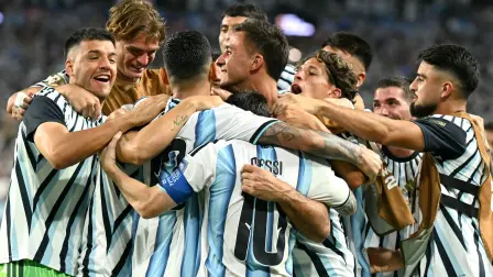 Argentina's defender #13 Cristian Romero celebrates with teammates scoring his team's third goal during the 2026 World Cup round of 32 football match between Argentina and Cape Verde at the Miami Stadium in Miami Gardens on July 3, 2026.  (Photo by CHANDAN KHANNA / AFP)