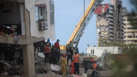 Rescuers work amid rubble at the site of a damaged building, in the aftermath of the June 24 earthquakes, in La Guaira, Venezuela, July 8, 2026. REUTERS/Adriano Machado