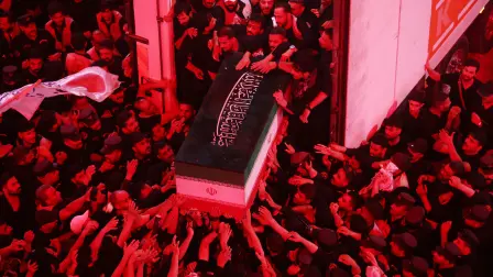 Mourners take part in the funeral procession of Iran's late supreme leader Ayatollah Ali Khamenei at Imam Hussein Shrine in Karbala early on July 9, 2026. Iranians were preparing on July 9 to bury their slain leader Ali Khamenei in his hometown of Mashhad in northeast Iran, as new US strikes threatened to trigger a fresh escalation in the Middle East war. The late leader's burial follows a multi-day funeral ceremony that attracted millions of mourners across various cities in both Iran and Iraq. (Photo by Ahmad AL-RUBAYE / AFP)