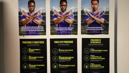 Posters show the FIFA three-step procedure against racism and discriminatory behaviour at the locker rooms of the Dallas Stadium in Arlington on July 12, 2026, ahead of the 2026 World Cup football tournament semi-final match between France and Spain on July 14.  (Photo by FRANCK FIFE / AFP)