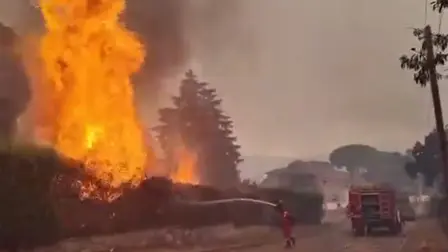 This screengrab from a video posted on the X account of Spain's Military Emergencies Unit UME (@UMEgob) on July 23, 2026, shows UME personnel fighting a wildfire in San Martín de Valdeiglesias, Madrid. In Spain, a fire broke out on July 22 afternoon in Almorox, near Toledo, southwest of Madrid, leading to the evacuation of several municipalities in the area and the lockdown of one of them, emergency services announced on X. Reflecting the rapid spread of the fire, authorities and emergency services twice sent an alert message to all mobile phones in the area to warn of the situation. (Photo by Handout / X account of Spain's Military Emergencies Unit UME (@UMEgob) / AFP) / RESTRICTED TO EDITORIAL USE - MANDATORY CREDIT "AFP PHOTO /  X account of Spain's Military Emergencies Unit UME (@UMEgob)  / HANDOUT" - NO MARKETING NO ADVERTISING CAMPAIGNS - DISTRIBUTED AS A SERVICE TO CLIENTS