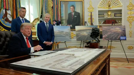 U.S. President Donald Trump uses a laser pointer on an airport model as he speaks next to U.S. Secretary of Transportation Sean Duffy and the CEO of United Airlines, Scott Kirby, during an announcement about a $22.5 billion renovation of Washington Dulles International Airport in the Oval Office at the White House in Washington, D.C., U.S., July 29, 2026. REUTERS/Kylie Cooper