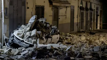 A car crushed by rubble stand on a debris-covered Via Pergolesi after a magnitude 4.7 earthquake struck the Campi Flegrei area, in Pozzuoli, Italy, July 31, 2026. REUTERS/Salvatore Laporta