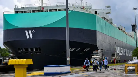A cargo ship sails through the Miraflores Locks on the Panama Canal in Panama City, on April 8, 2025. US Secretary of Defense Pete Hegseth is due to visit the Panama Canal within an official visit to the country. (Photo by MARTIN BERNETTI / AFP)