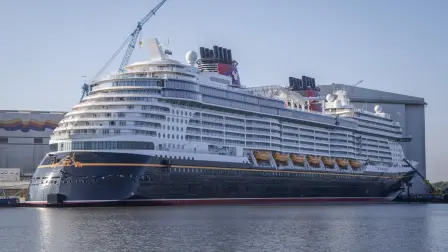 The new Disney Treasure cruise ship of Disney Cruise line is moored at the Meyer shipyards in Papenburg, northwestern Germany on September 16, 2024. At the company meeting, the employees were informed that the troubled luxury shipbuilder had been saved by the intervention of the Federal Republic of Germany and the state of Lower Saxony. (Photo by Focke STRANGMANN / AFP)