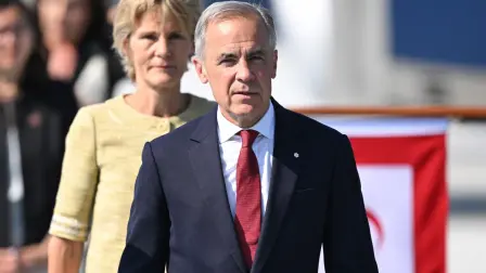Canada's Prime Minister Mark Carney and his wife, Diana Fox Carney arrive at Esenboga Airport to attend the 36th NATO Heads of State and Government Summit in Ankara on July 7, 2026. (Photo by Muhammed Abdullah Kurtar / POOL / AFP)