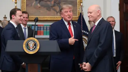 U.S. President Donald Trump speaks next to CEO of Intercontinental Exchange Jeffrey C. Sprecher in the Roosevelt Room at the White House in Washington D.C., U.S., August 19, 2026. REUTERS/Kylie Cooper