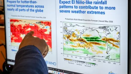 Head of climate prediction services at the World Meteorological Organization (WMO) Wilfran Moufouma-Okia points on graphs displayed on a computer screen at the WMO headquarters in Geneva, on June 1, 2026. There is an 80-percent chance of the warming El Nino phenomenon developing between June and August, increasing the risk of extreme weather events, the World Meteorological Organization said on June 2, 2026. (Photo by Fabrice COFFRINI / AFP)