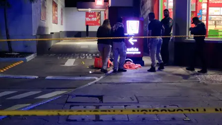 Forensic technicians and police officers work at the crime scene where Mexican social media influencer Cesar Gastelum, known for his comedy videos and followed by nearly 600,000 people on TikTok, was shot and killed while livestreaming with friends outside a fast-food restaurant in Culiacan, Sinaloa state, Mexico, August 4, 2026. REUTERS/Jesus Bustamante
