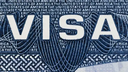 This illustration picture shows a US visa in a passport in Mexico City on August 25, 2026. The US government plans to revoke the visas of foreigners who came to the country for tourism or business but sought to stay longer by applying for asylum, the State Department said on August 25, 2026. (Photo by Yuri CORTEZ / AFP)
