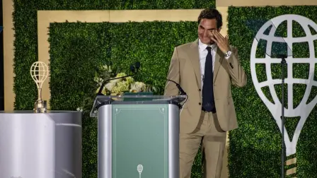 Swiss former tennis player Roger Federer wipes away tears as he is inducted into the International Tennis Hall of Fame during a ceremony in Newport, Rhode Island, on August 29, 2026. (Photo by Joseph Prezioso / AFP)