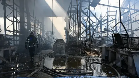 An emergency services specialist works on the site of a destroyed DIY and construction materials mall "Galaktika" following an overnight attack, which local Russian-installed officials have attributed to Ukrainian drone strikes, in Mariupol, Russian-controlled Ukraine, on September, 7, 2026, amid the ongoing Russian-Ukrainian conflict. (Photo by AFP)