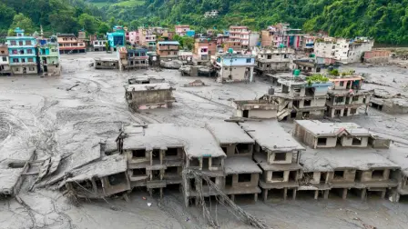 (FILES) An aerial view shows houses lying deluged in sludge after flash floods at Devighat, Bidur Municipality in Nepal's Nuwakot district on August 27, 2026. The August 26 tsunami-like surge of water, mud and debris from a glacial mountain collapse on the China-Nepal border left more than 5,650 missing, including hundreds of foreigners. (Photo by Prabin RANABHAT / AFP)