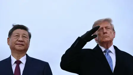 US President Donald Trump (R) greets Chinese President Xi Jinping upon arrival at Joint Base Andrews in Maryland on September 23, 2026. Xi is visiting the United States from September 23 to 25. (Photo by Brendan SMIALOWSKI / AFP)