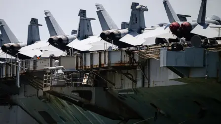 F/A-18E Super Hornets are seen on the flight deck of USS Abraham Lincoln (CVN-72) while docked at Laem Chabang Port, near the city of Pattaya on September 3, 2026.  (Photo by ANTHONY WALLACE / AFP)