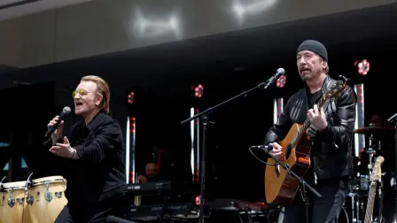 Bono and The Edge of U2 perform during the opening of the Barack Obama Presidential Center in Chicago, Illinois, on June 18, 2026. (Photo by Kamil Krzaczynski / AFP)