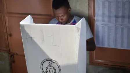A man casts his vote at the Canape Vert market, in the Haitian Capital of Port-au-Prince, on January 29, 2017 during the local and legislative elections. Haiti is holding elections for 5,536 posts, including runoffs for eight Senate seats. (Photo by HECTOR RETAMAL / AFP)